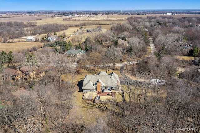 birds eye view of property with a rural view