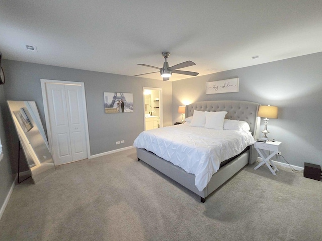 carpeted bedroom with a ceiling fan, baseboards, visible vents, and a closet