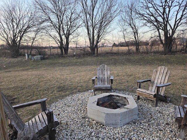 view of yard with a fire pit