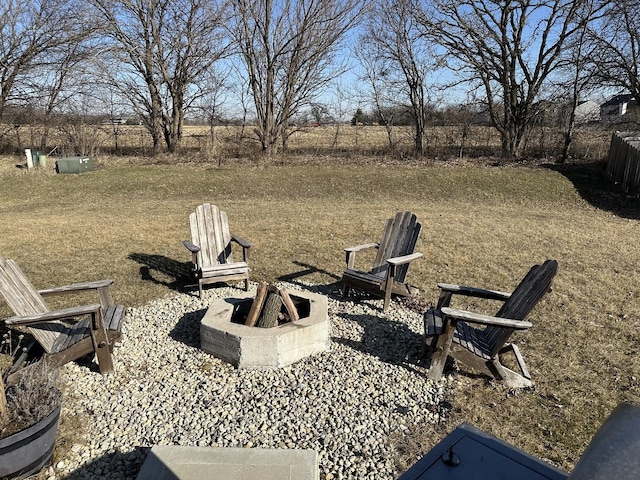 view of yard featuring an outdoor fire pit