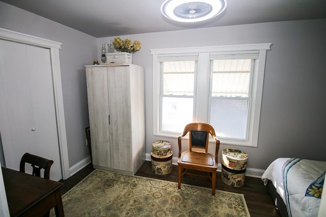 bedroom with baseboards and wood finished floors