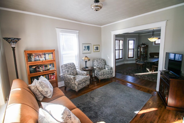 living room with baseboards, ornamental molding, and hardwood / wood-style flooring