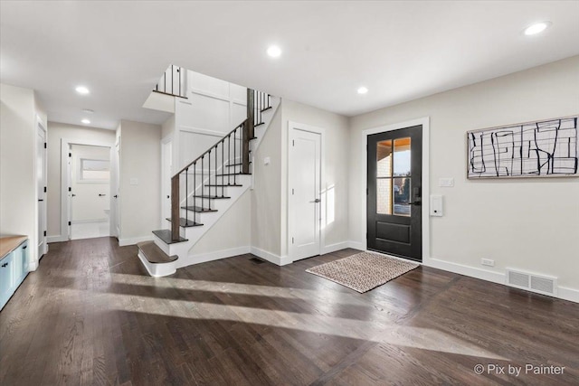 entrance foyer with recessed lighting, dark wood-style floors, visible vents, and baseboards