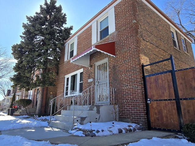 view of front of house with brick siding