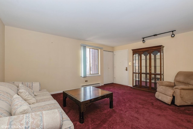 living room featuring track lighting, carpet, and a baseboard radiator