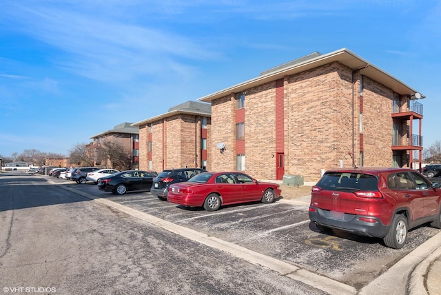 view of property featuring uncovered parking