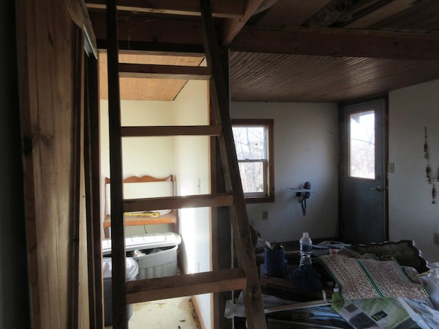 bedroom featuring beam ceiling and wooden ceiling