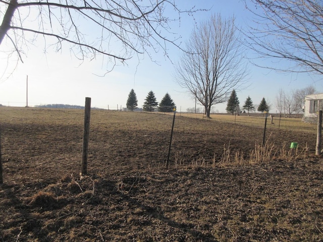 view of yard with a rural view