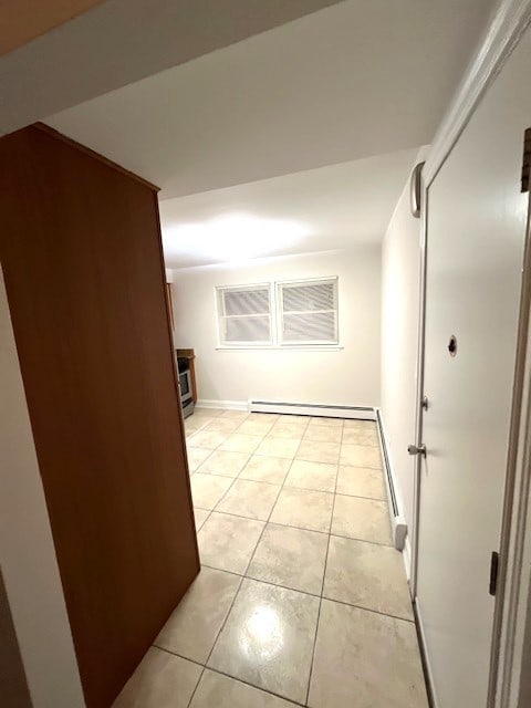 hallway with light tile patterned floors