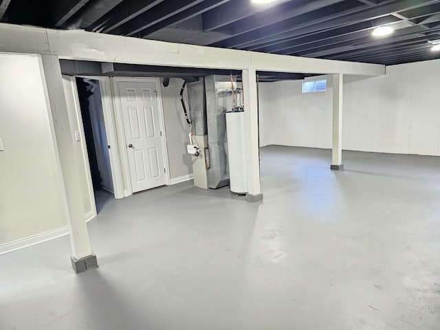 basement featuring heating unit and water heater