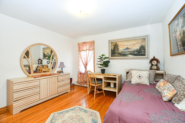 bedroom featuring light wood finished floors