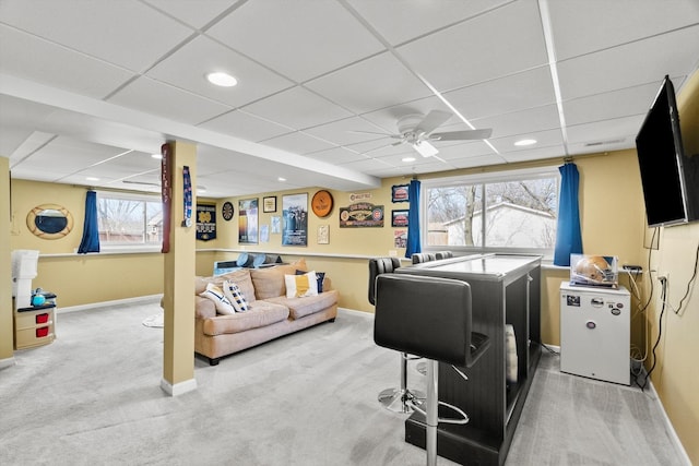 clothes washing area featuring a wealth of natural light, baseboards, and carpet