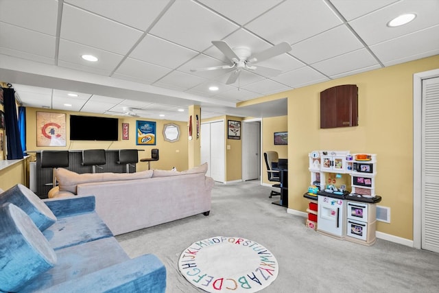 living area featuring a ceiling fan, visible vents, baseboards, carpet floors, and recessed lighting