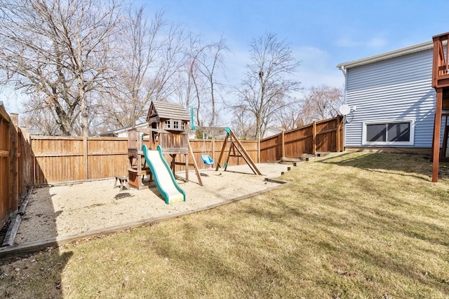 view of jungle gym with a yard and a fenced backyard