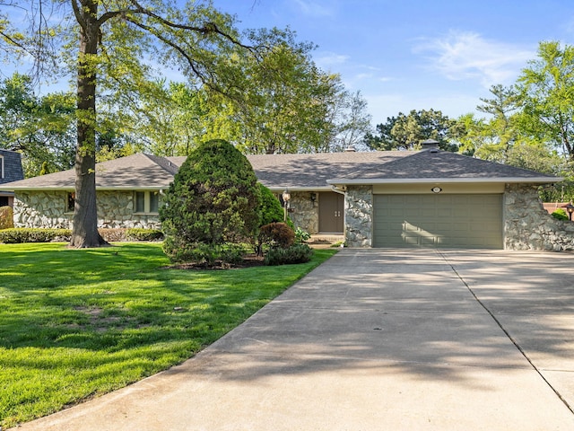 41 Mockingbird Ln, Oak Brook, IL 60523 - view of front facade with stone siding, concrete driveway, a garage, a front lawn, and roof with shingles