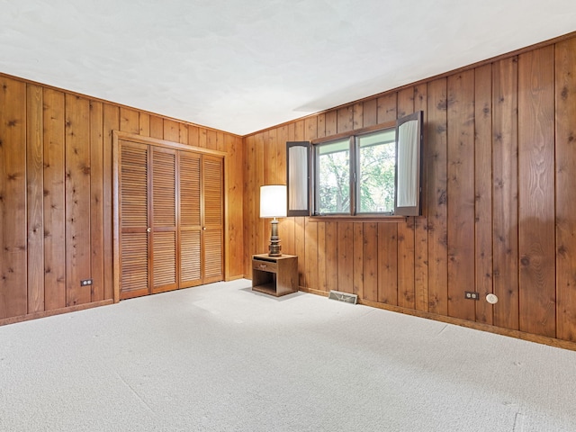 41 Mockingbird Ln, Oak Brook, IL 60523 - spare room with carpet, wood walls, and baseboards