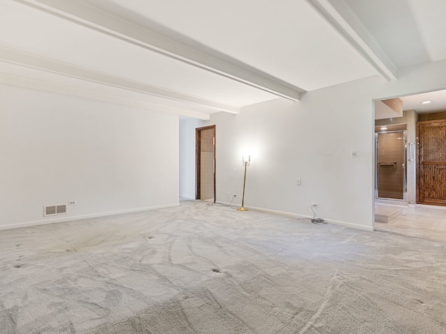 41 Mockingbird Ln, Oak Brook, IL 60523 - empty room with beam ceiling, light carpet, and baseboards