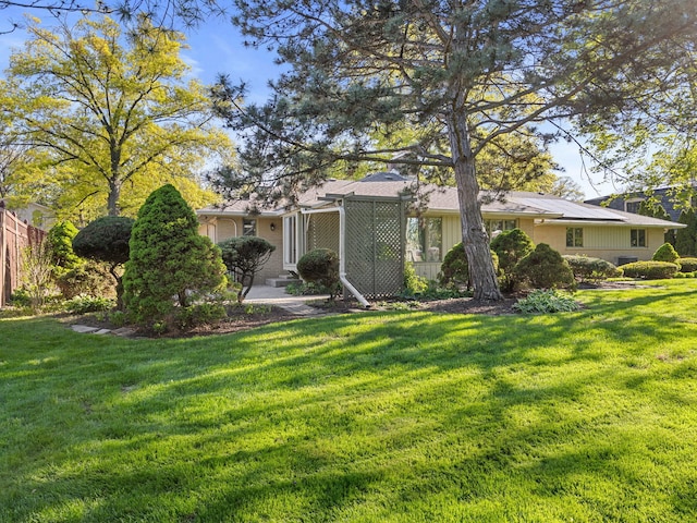 41 Mockingbird Ln, Oak Brook, IL 60523 - rear view of property featuring a lawn