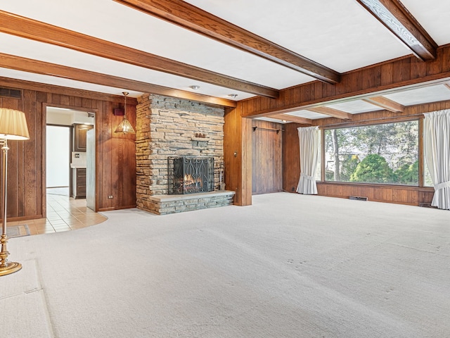 41 Mockingbird Ln, Oak Brook, IL 60523 - unfurnished living room featuring wooden walls, beamed ceiling, carpet flooring, and a fireplace
