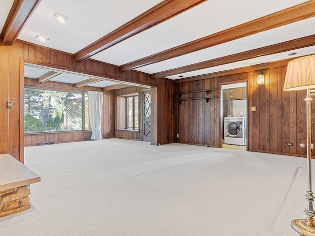 41 Mockingbird Ln, Oak Brook, IL 60523 - unfurnished living room with washer / clothes dryer, beam ceiling, wood walls, and carpet flooring