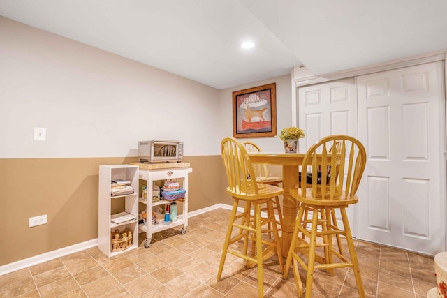 dining room featuring baseboards