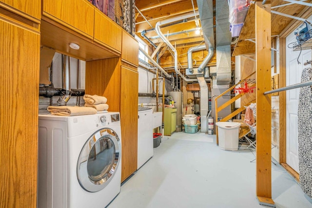 unfinished basement with gas water heater and washer and dryer