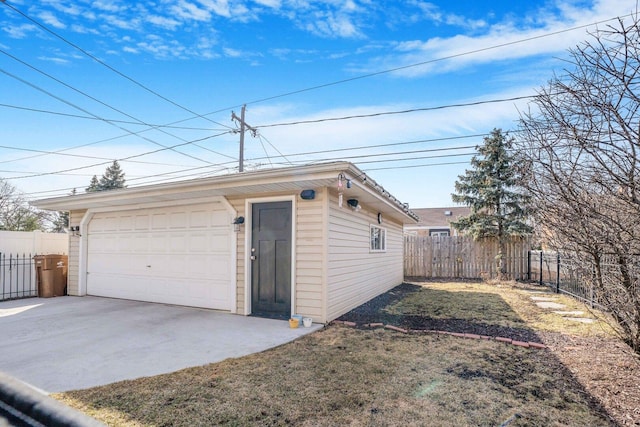 detached garage featuring fence