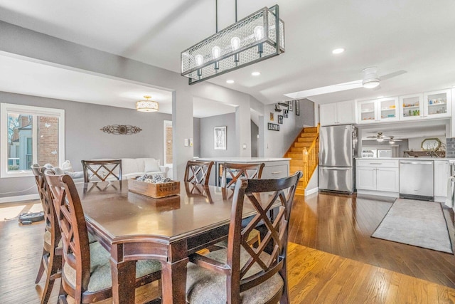 dining room featuring recessed lighting, stairway, light wood-style flooring, and ceiling fan