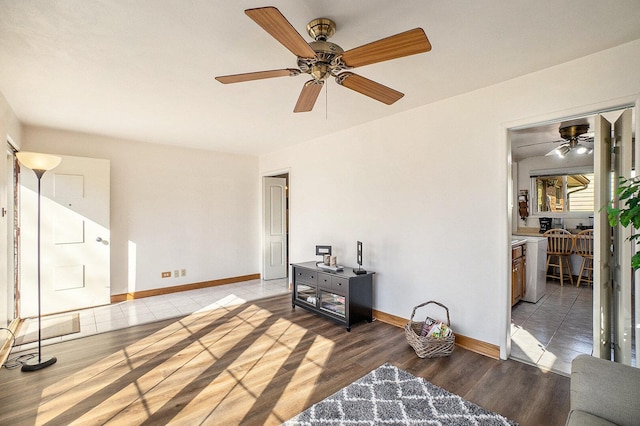 living room with wood finished floors and baseboards