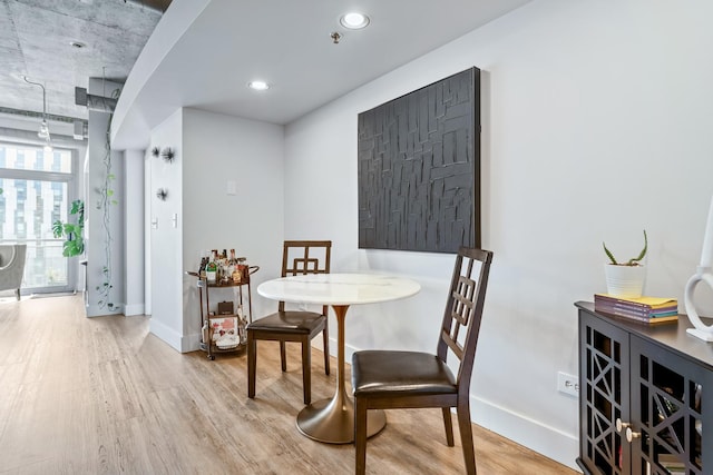 dining room with wood finished floors and baseboards