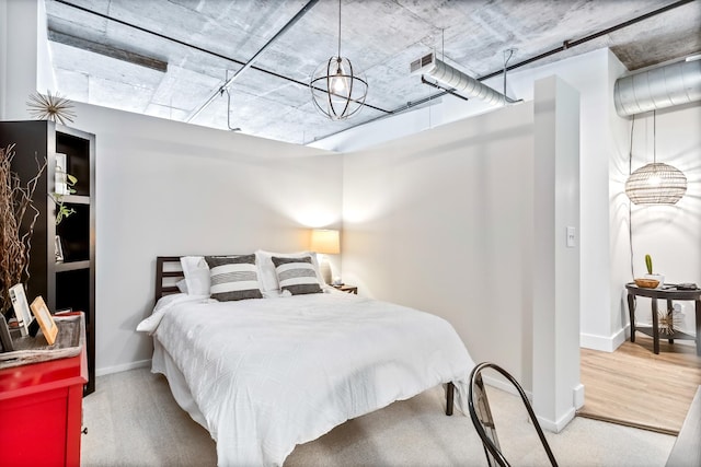 carpeted bedroom featuring baseboards