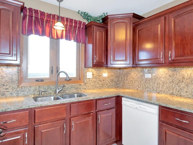 kitchen featuring a sink, decorative backsplash, light stone countertops, and dishwasher