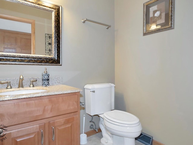 bathroom featuring tile patterned floors, visible vents, toilet, baseboards, and vanity