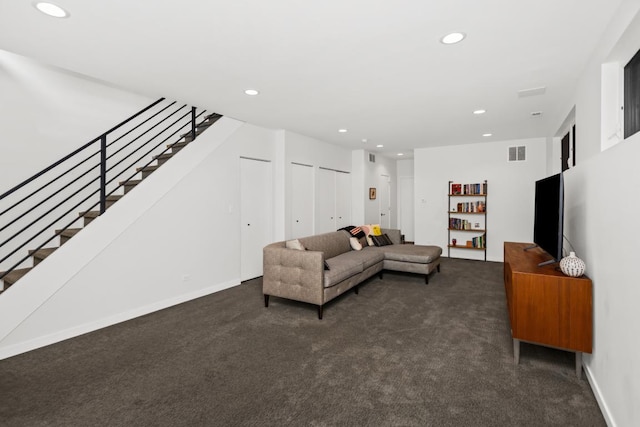 carpeted living area featuring recessed lighting, visible vents, baseboards, and stairs