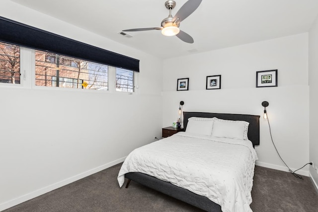 bedroom with visible vents, baseboards, a ceiling fan, and dark carpet