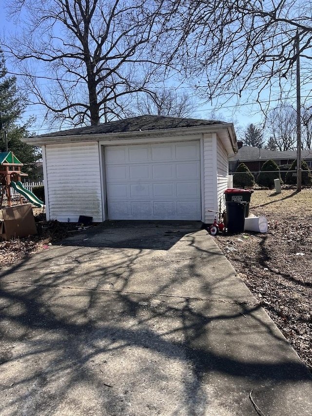 detached garage featuring driveway