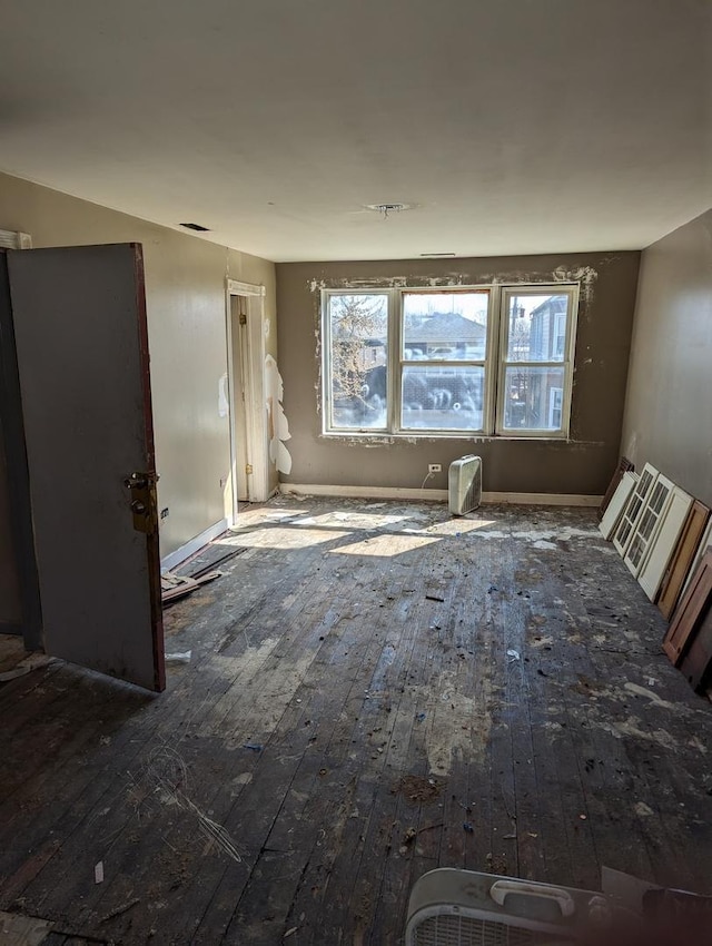 spare room featuring hardwood / wood-style flooring