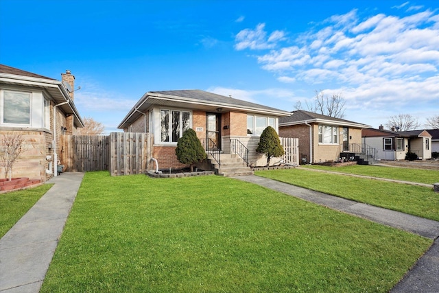 bungalow with brick siding, a front lawn, and fence