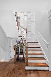 stairs with wood finished floors