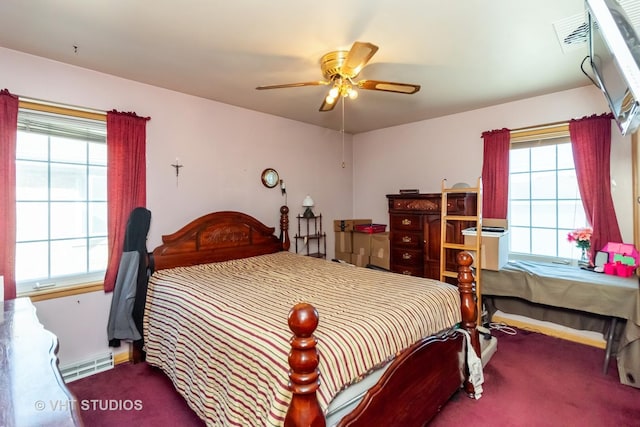 bedroom featuring a ceiling fan, carpet, baseboards, and baseboard heating