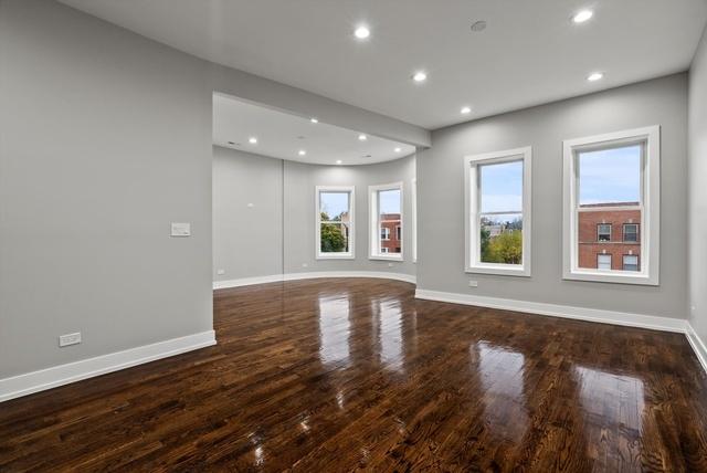 spare room with recessed lighting, baseboards, and wood finished floors