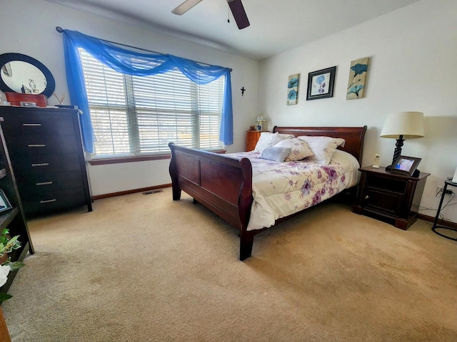 bedroom featuring a ceiling fan, carpet flooring, baseboards, and visible vents