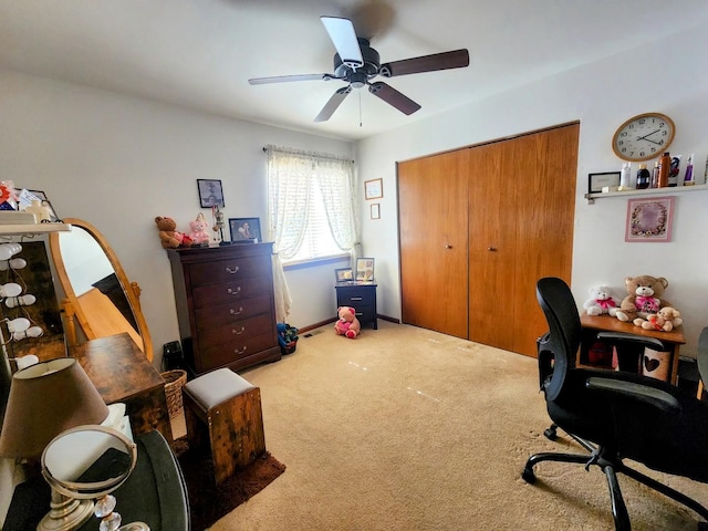 carpeted office featuring a ceiling fan