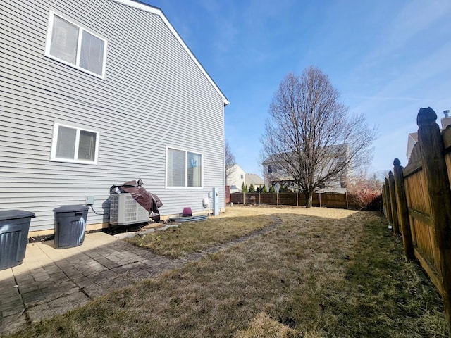 view of yard featuring a patio area, cooling unit, and a fenced backyard