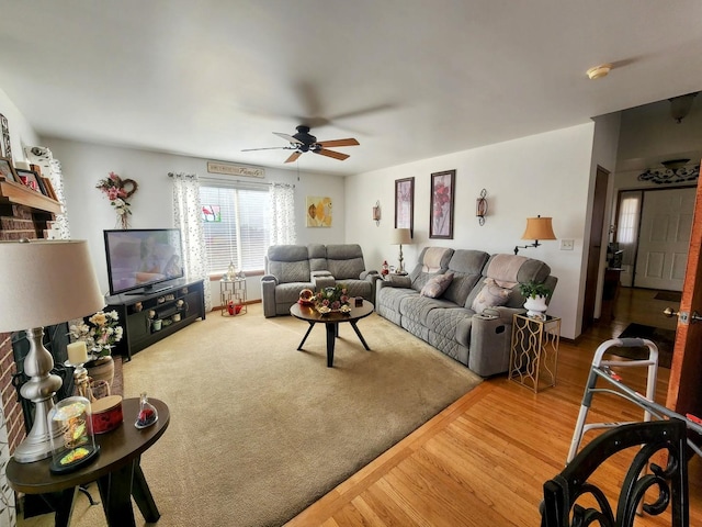 living room featuring ceiling fan and wood finished floors