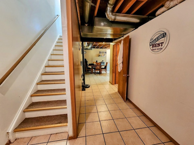 stairway with tile patterned flooring