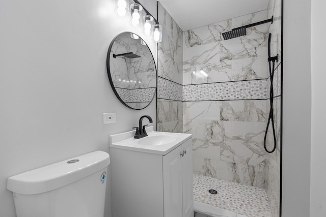 bathroom with a marble finish shower, toilet, and vanity