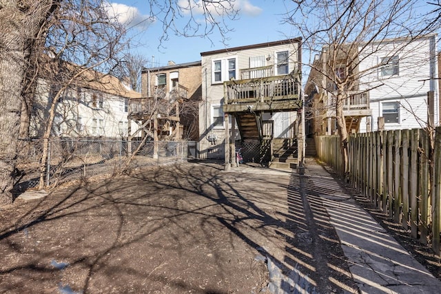 rear view of house with fence