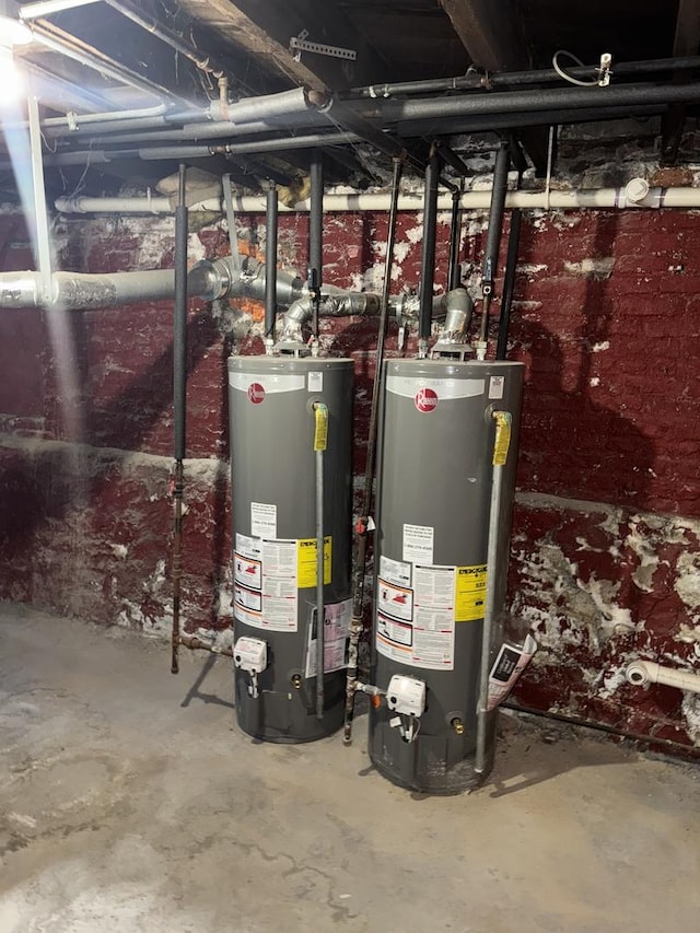 utility room featuring water heater