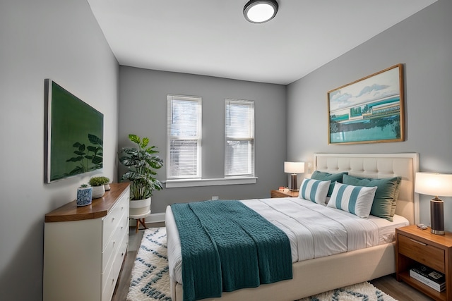 bedroom with wood finished floors